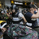 Hong Kong police beat a pro-democracy protester in Admiralty.